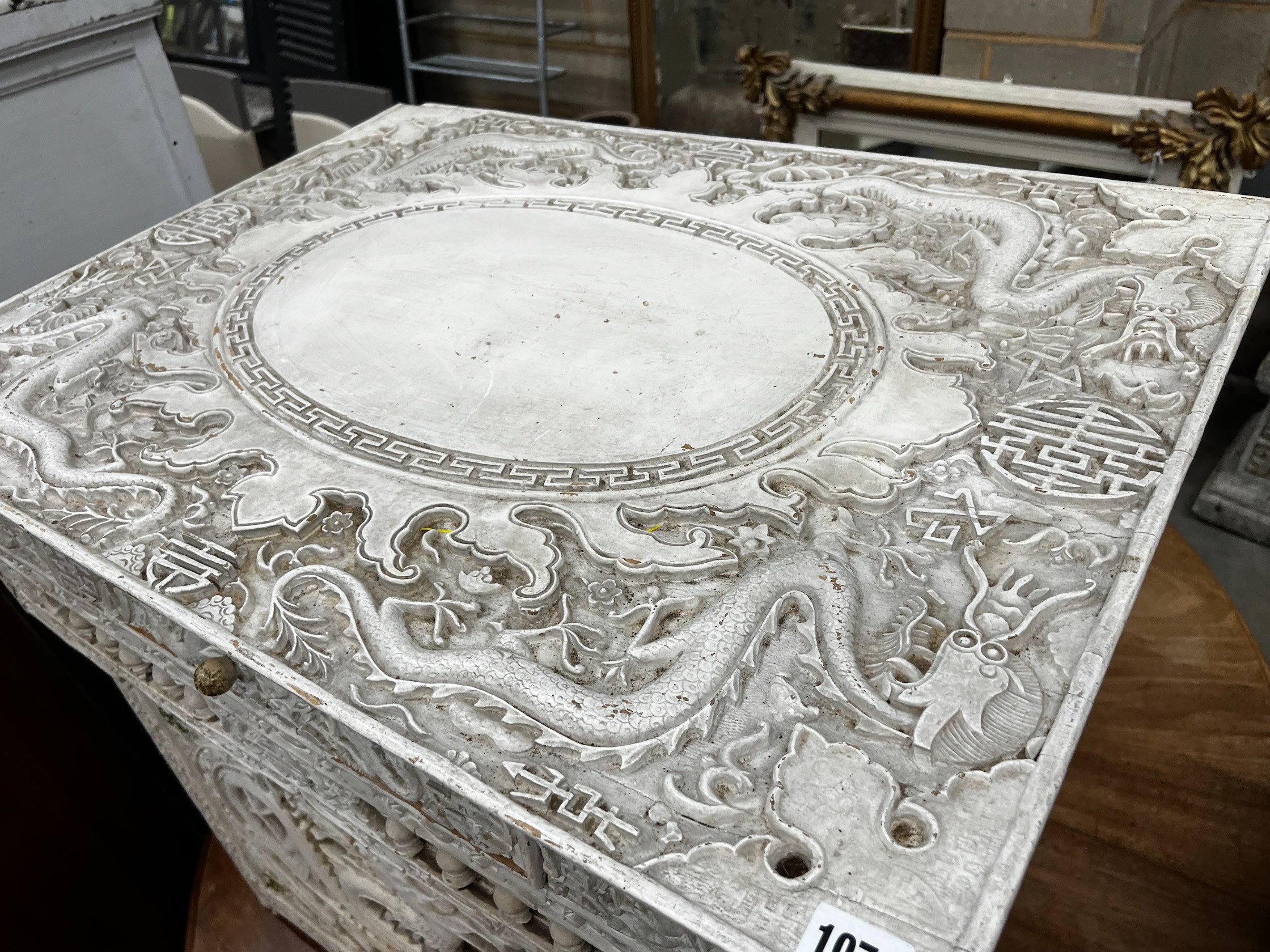 An early 20th century Chinese carved side table, width 75cm depth 56cm height 67cm (later painted)